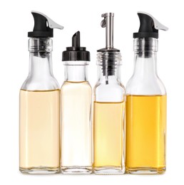 Photo of Different glass bottles with cooking oil on white background