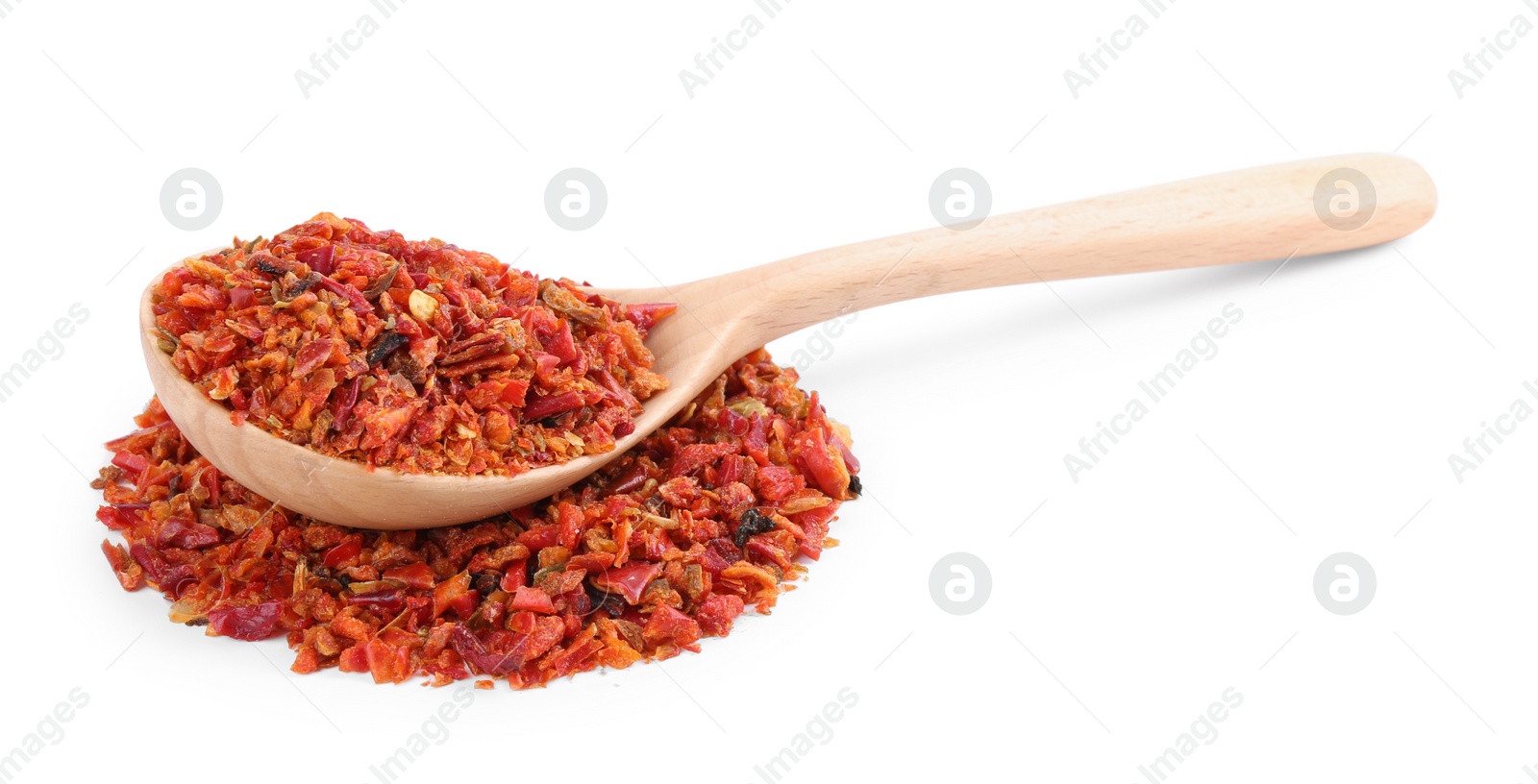 Photo of Aromatic spice. Red chili pepper flakes and spoon isolated on white