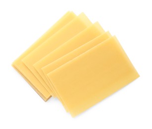 Stack of uncooked lasagna sheets isolated on white, top view