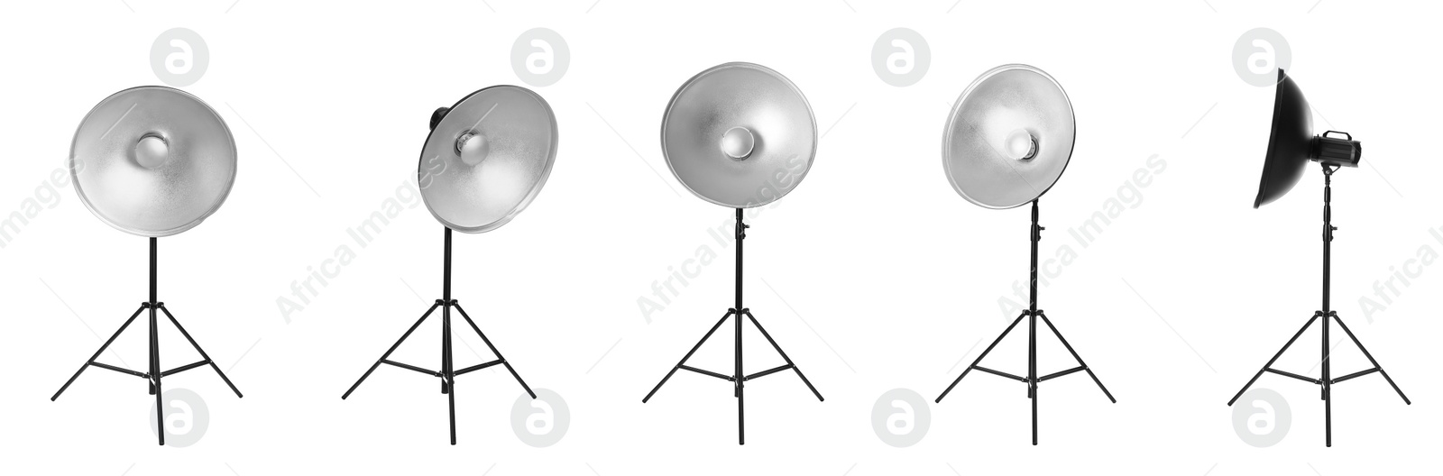 Image of Set with studio flash lights with reflectors on tripods against white background. Banner design