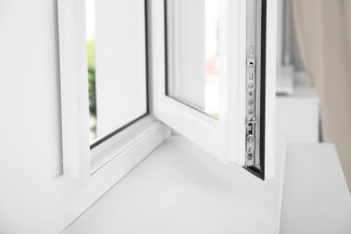 Photo of Modern window indoors, closeup view. Home interior