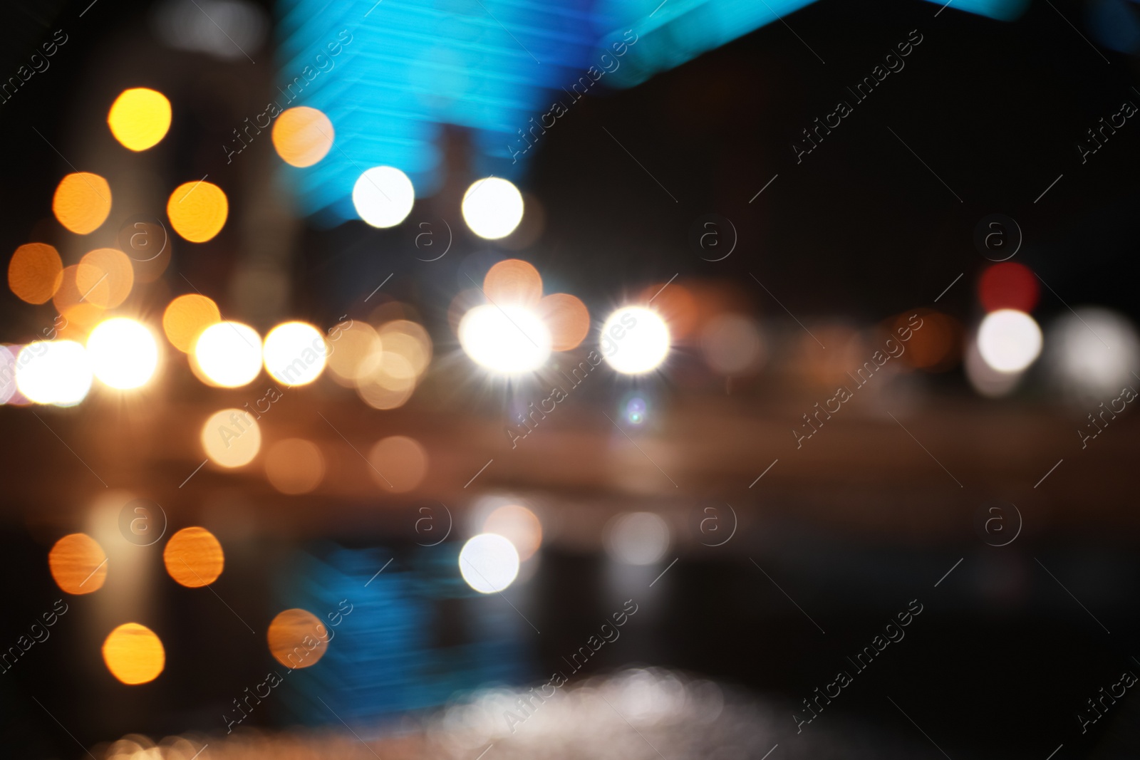 Photo of Blurred view of cityscape with bokeh effect. Night life