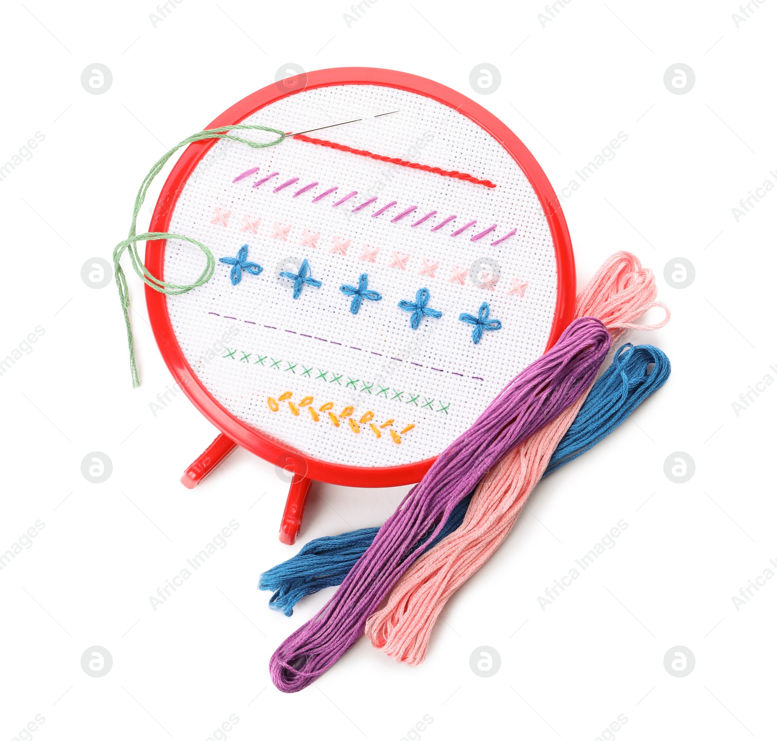 Photo of Set of embroidery equipment on white background, top view