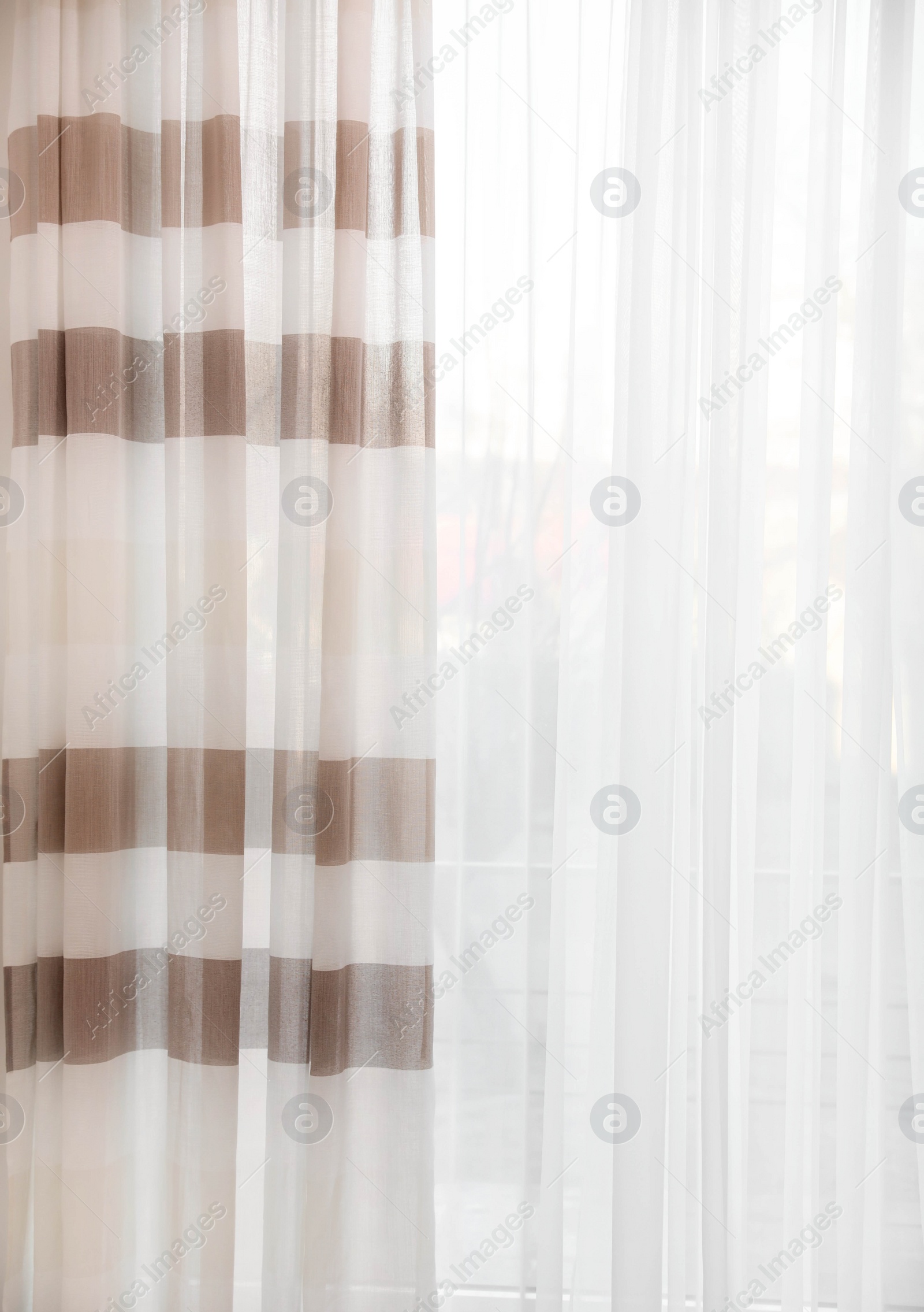 Photo of Window with elegant curtains in empty room