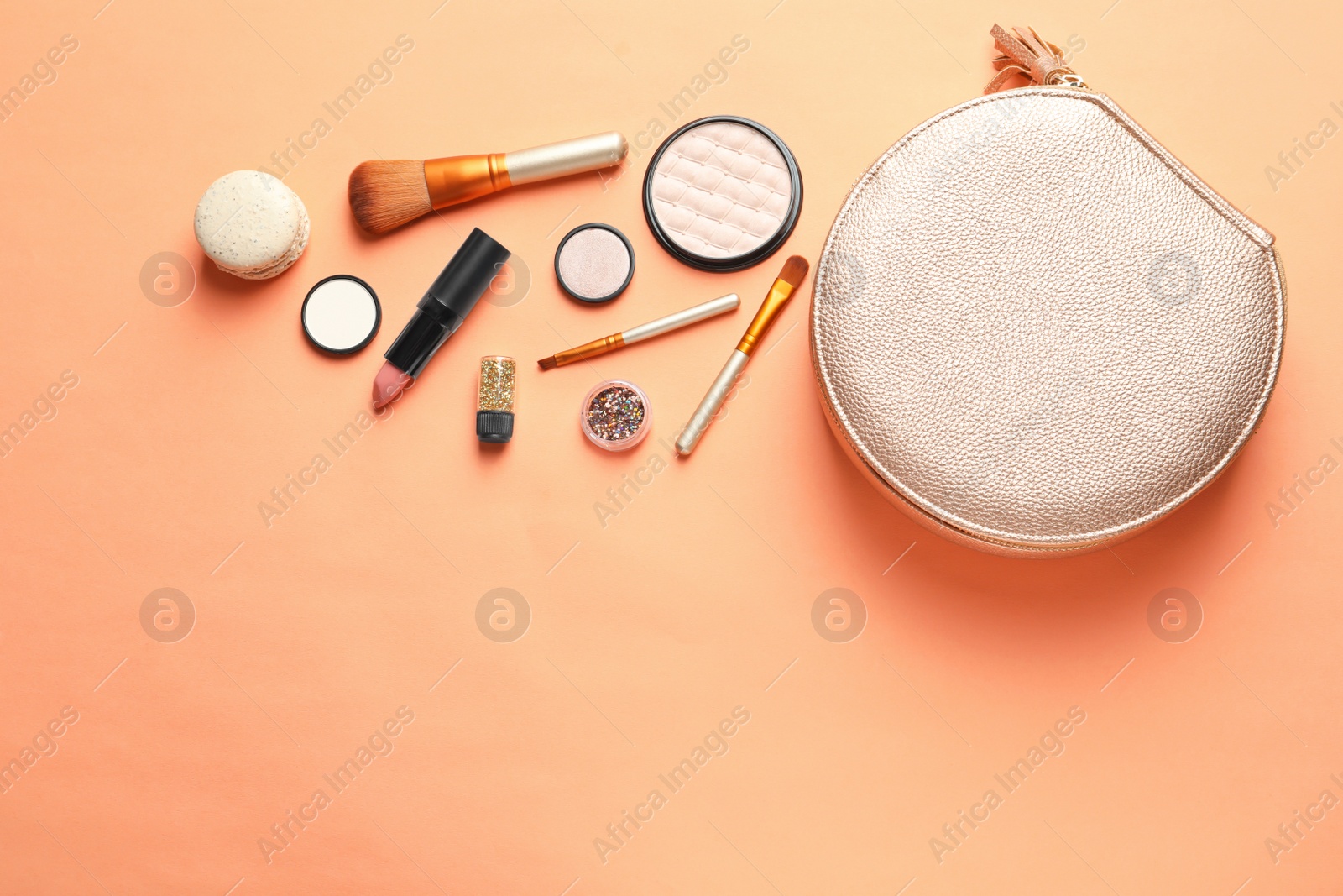 Photo of Makeup products with cosmetic bag on color background