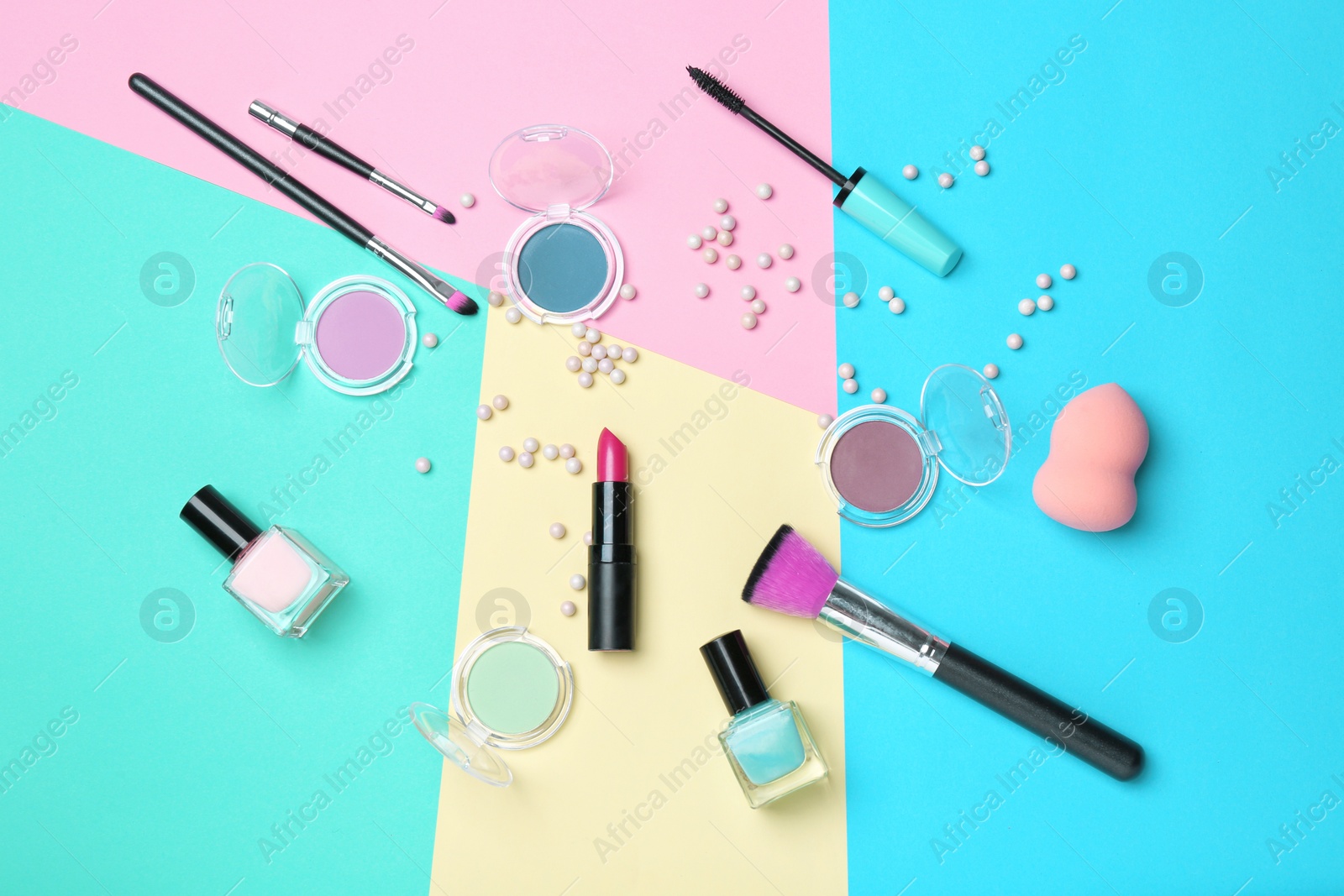 Photo of Decorative makeup products on color background