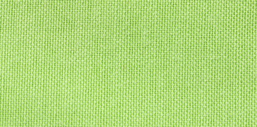 Texture of green fabric as background, top view