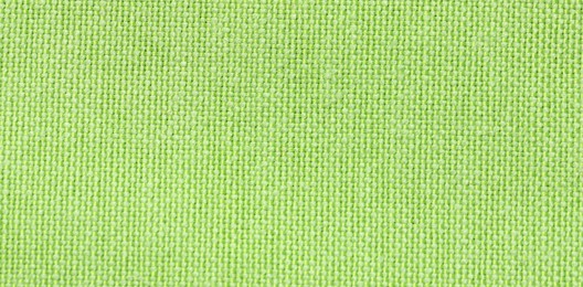 Photo of Texture of green fabric as background, top view