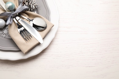 Photo of Beautiful Christmas table setting on white wooden background, top view. Space for text