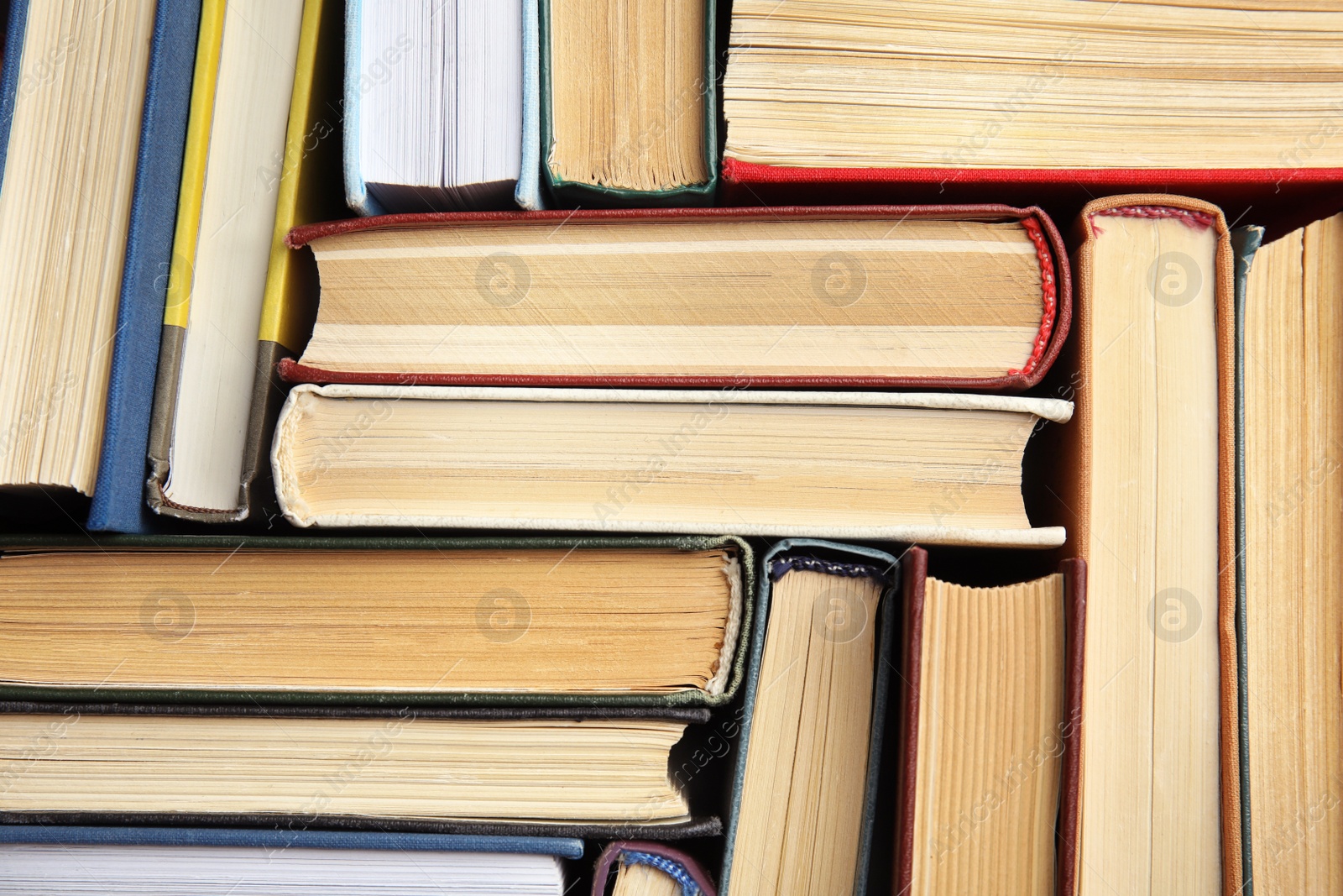 Photo of Many different hardcover books as background, top view