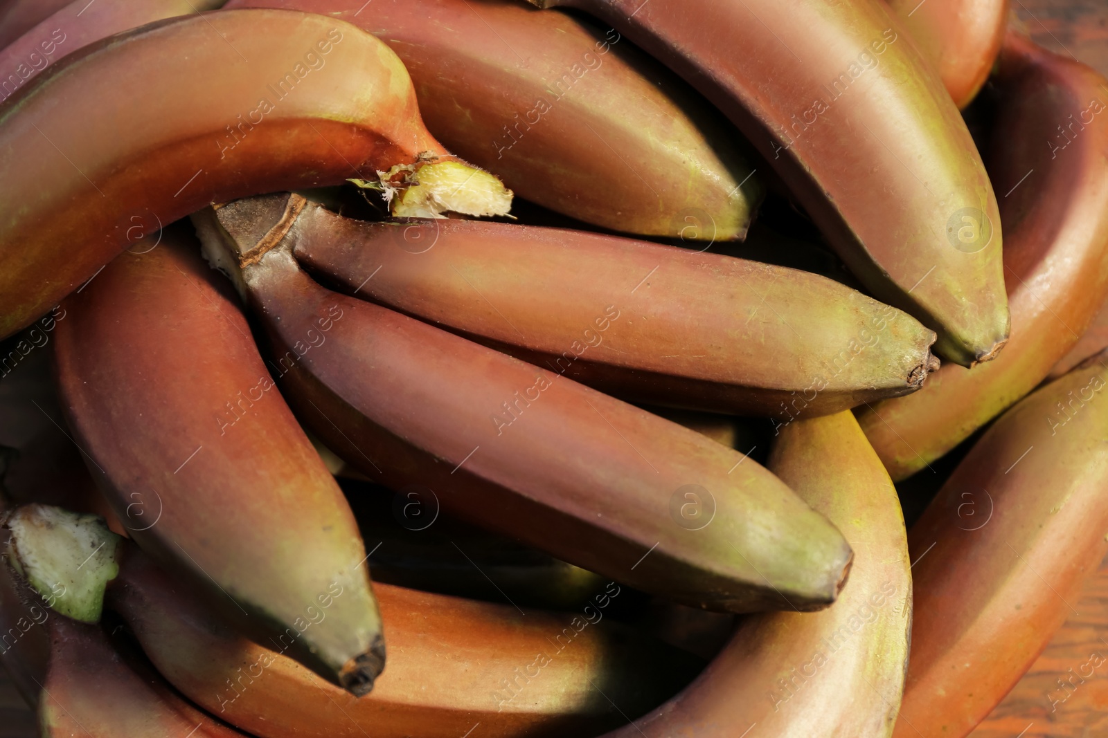 Photo of Delicious purple bananas as background, top view