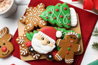 Photo of Tasty homemade Christmas cookies on white wooden table, top view