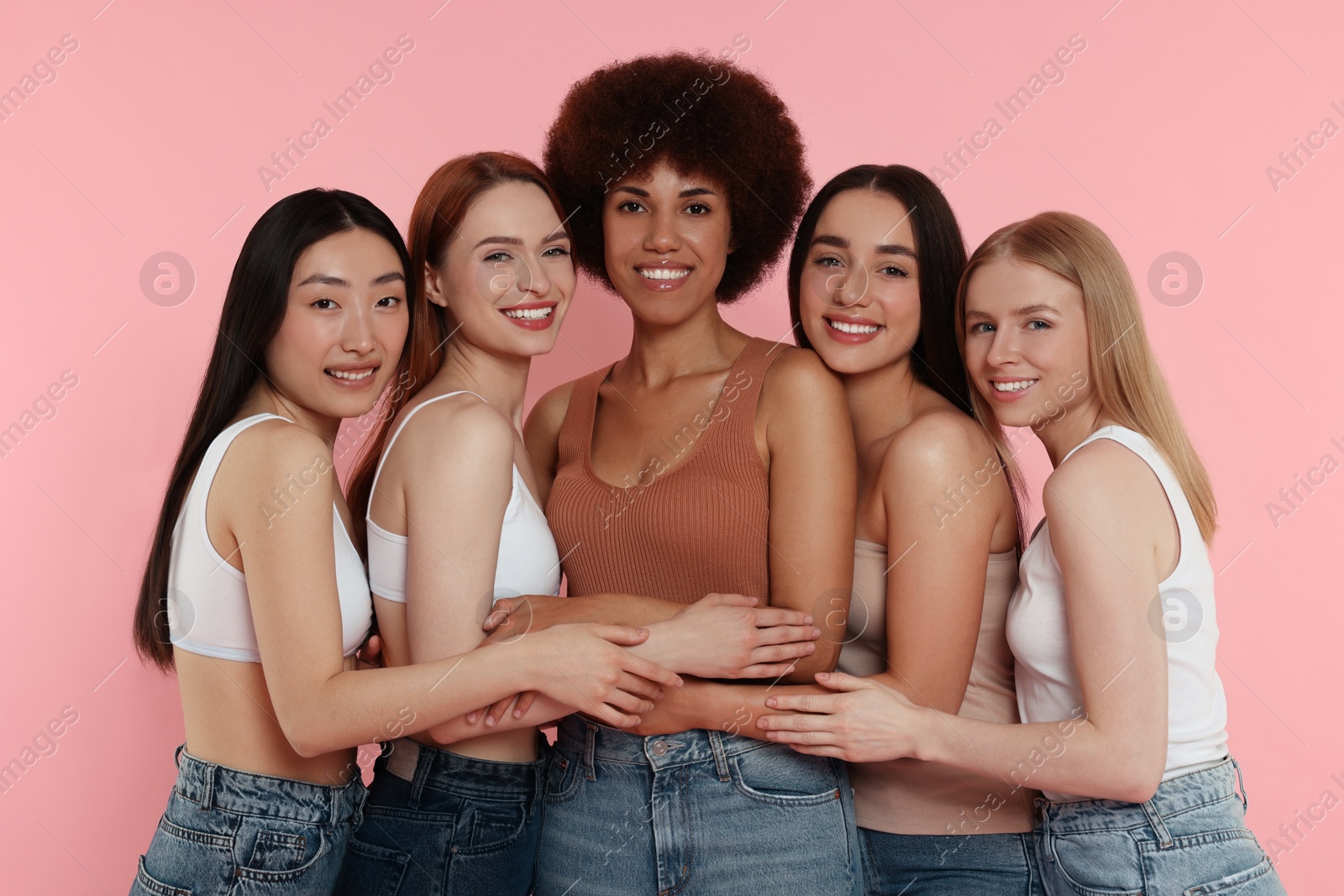 Photo of Portrait of beautiful young women on pink background