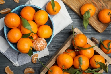 Photo of Flat lay composition with fresh ripe tangerines on wooden background