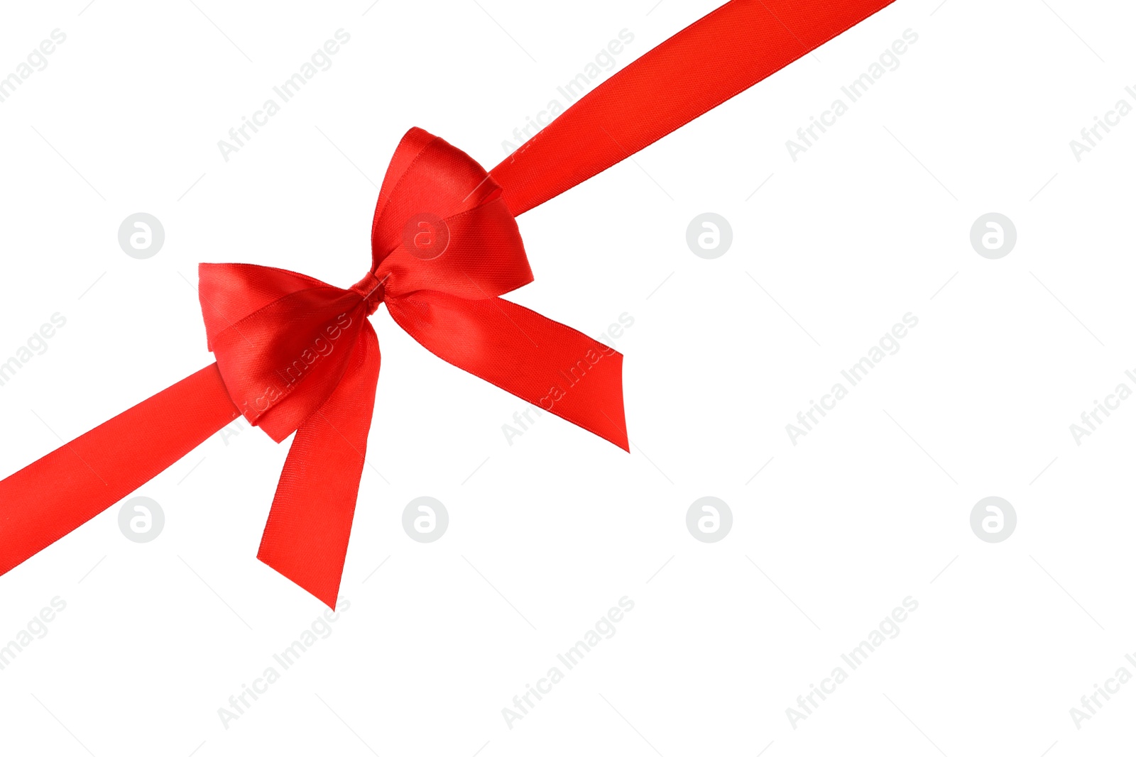 Photo of Red ribbon with bow on white background. Festive decoration