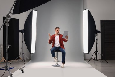 Photo of Casting call. Man with script performing in studio