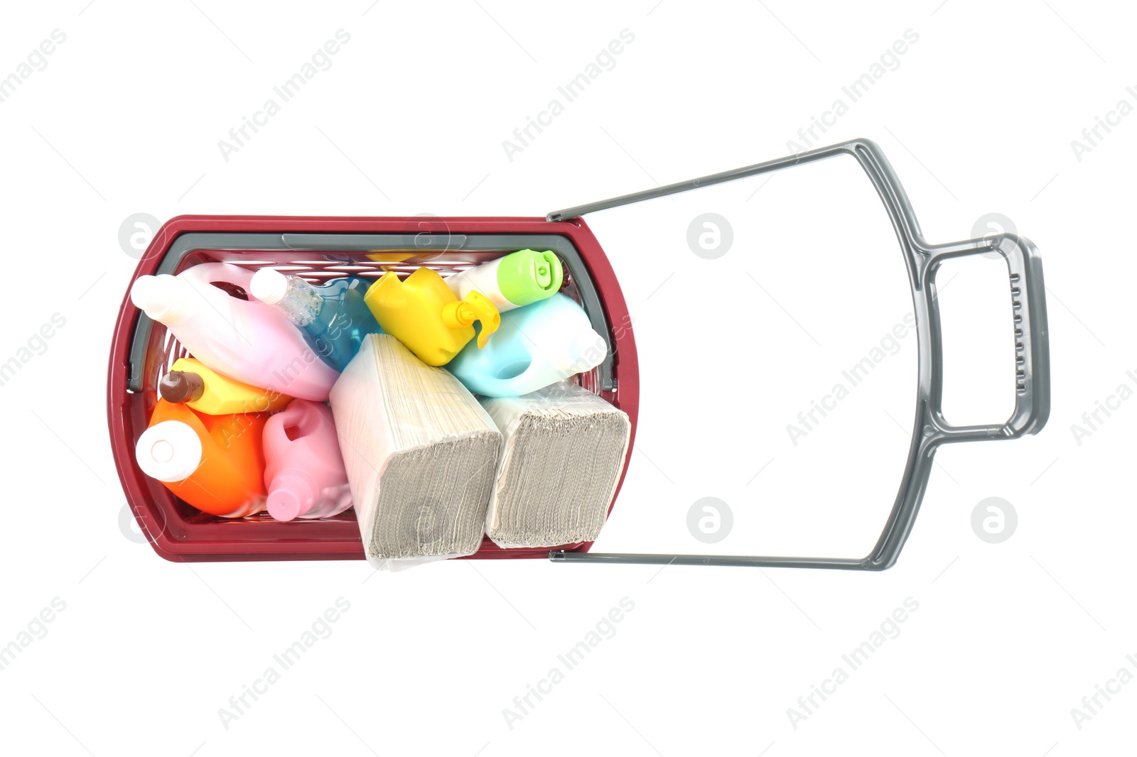 Photo of Shopping basket full of cleaning supplies isolated on white, top view