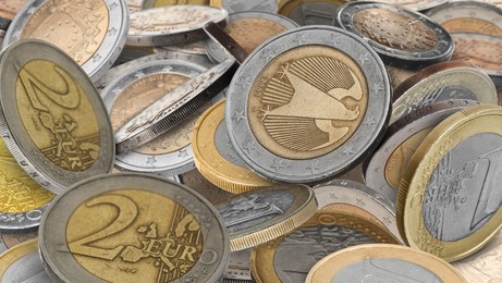 Many different euro coins as background, closeup