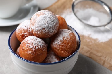 Delicious sweet buns in bowl on table, closeup
