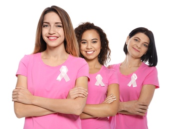 Photo of Group of women with silk ribbons on white background. Breast cancer awareness concept