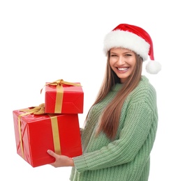 Photo of Happy young woman in Santa hat with Christmas gifts on white background