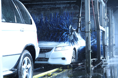 Photo of Modern auto undergoing cleaning at car wash