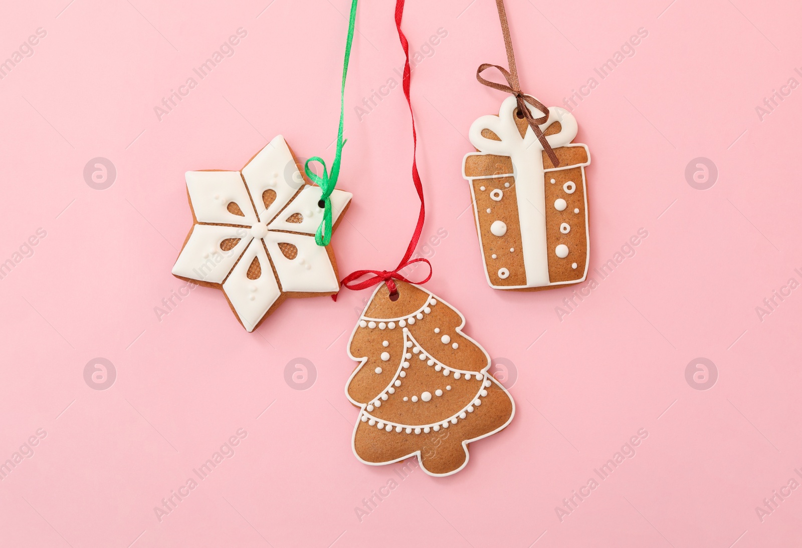 Photo of Different delicious Christmas cookies on pink background, flat lay