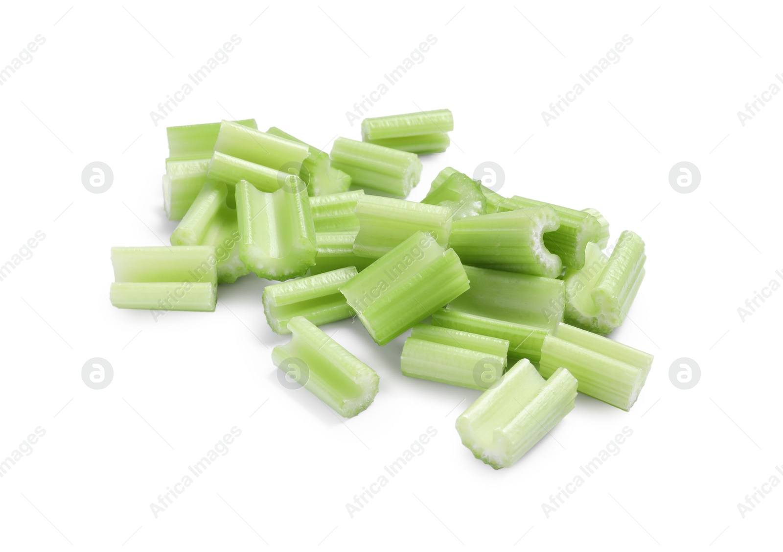 Photo of Heap of fresh cut celery isolated on white