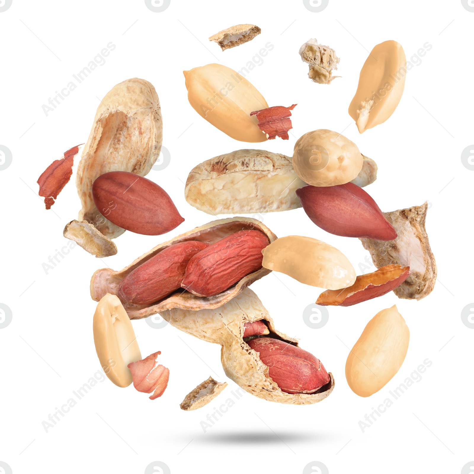 Image of Peanuts and crushed pods in air on white background