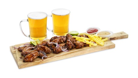 Photo of Wooden board with tasty roasted chicken wings, french fries, mugs of beer and sauces isolated on white