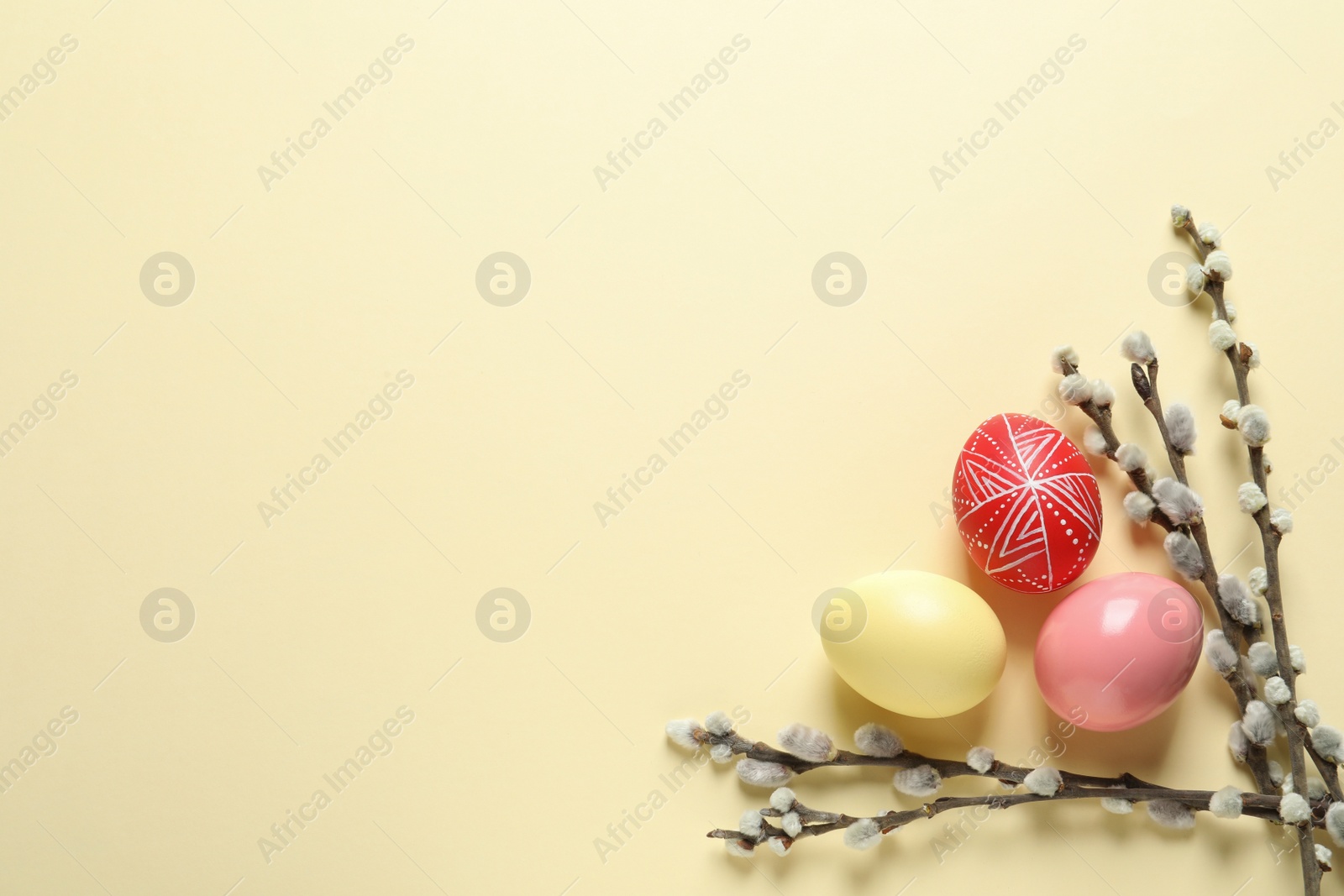 Photo of Flat lay composition with painted Easter eggs on color background, space for text