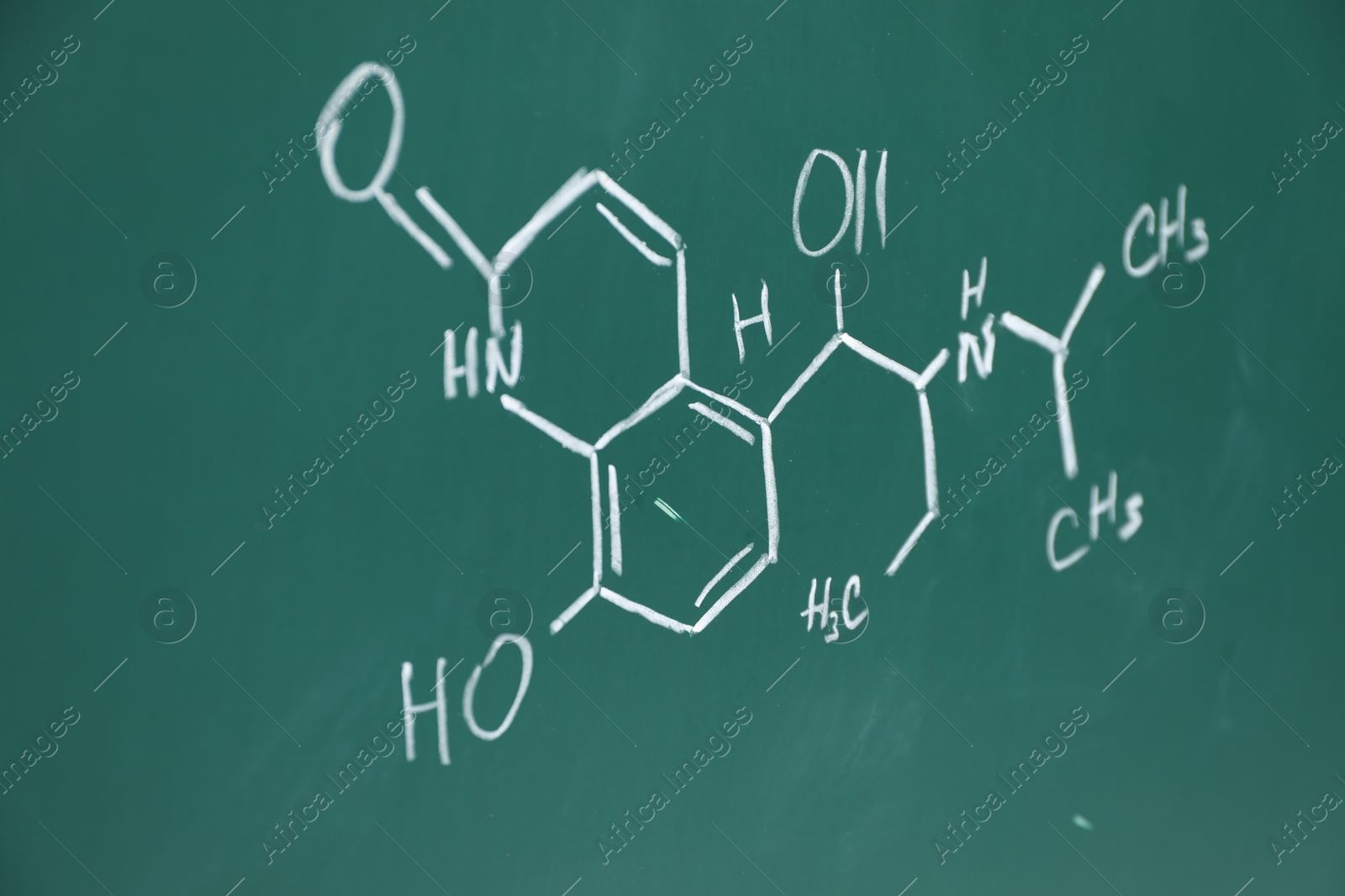 Photo of Chemical formulas written with chalk on green board