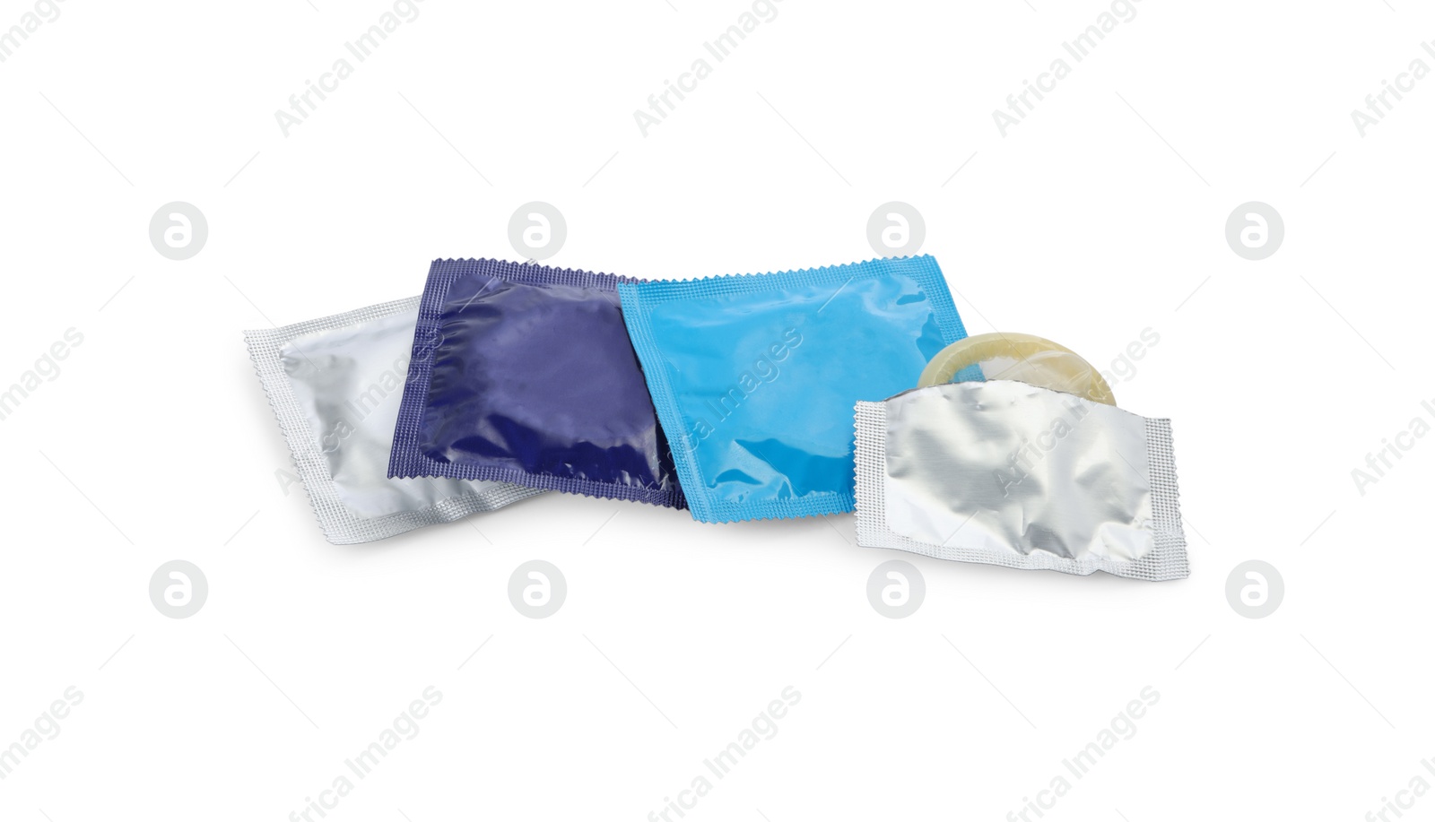 Photo of Many condoms on white background. Safe sex