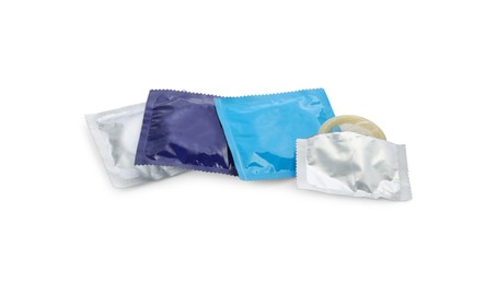Photo of Many condoms on white background. Safe sex