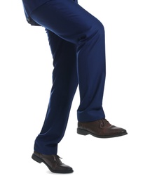 Photo of Businessman walking on white background, closeup. Career ladder