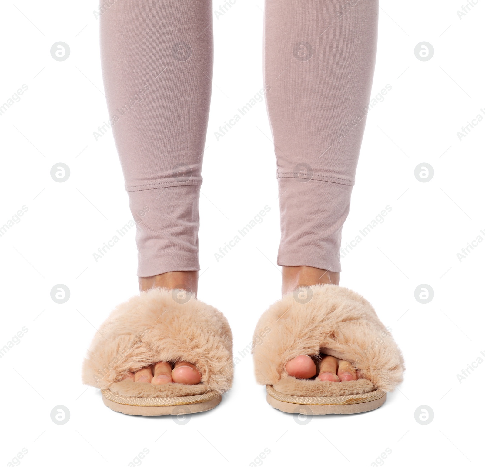 Photo of Woman in beige fluffy slippers on white background, closeup