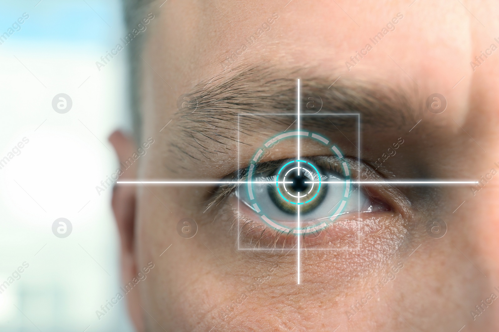 Image of Vision test. Laser reticle focused on man's eye, closeup