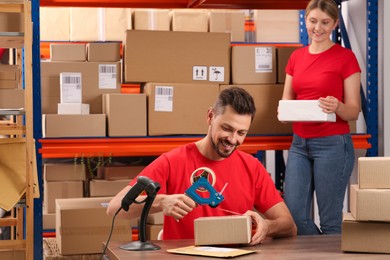 Photo of Man and woman working at post office