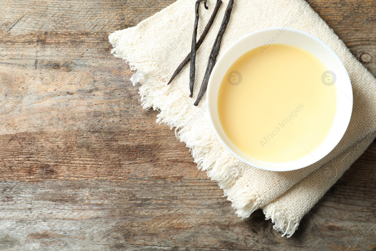 Photo of Bowl of condensed milk served on table, top view with space for text. Dairy products