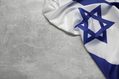 Photo of Flag of Israel on grey textured background, above view and space for text. National symbol