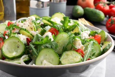 Photo of Plate of delicious cucumber salad on table, closeup