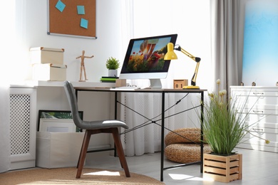 Comfortable workplace with modern computer on desk. Home office