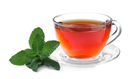 Photo of Cup of aromatic black tea with fresh mint on white background