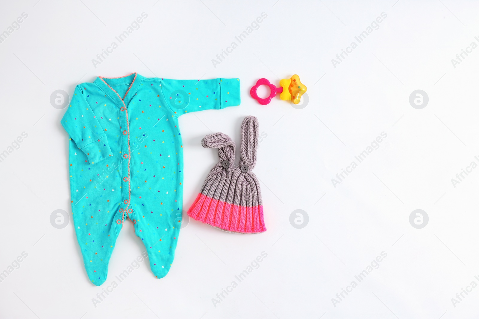 Photo of Set of baby clothes and accessories on light background, flat lay