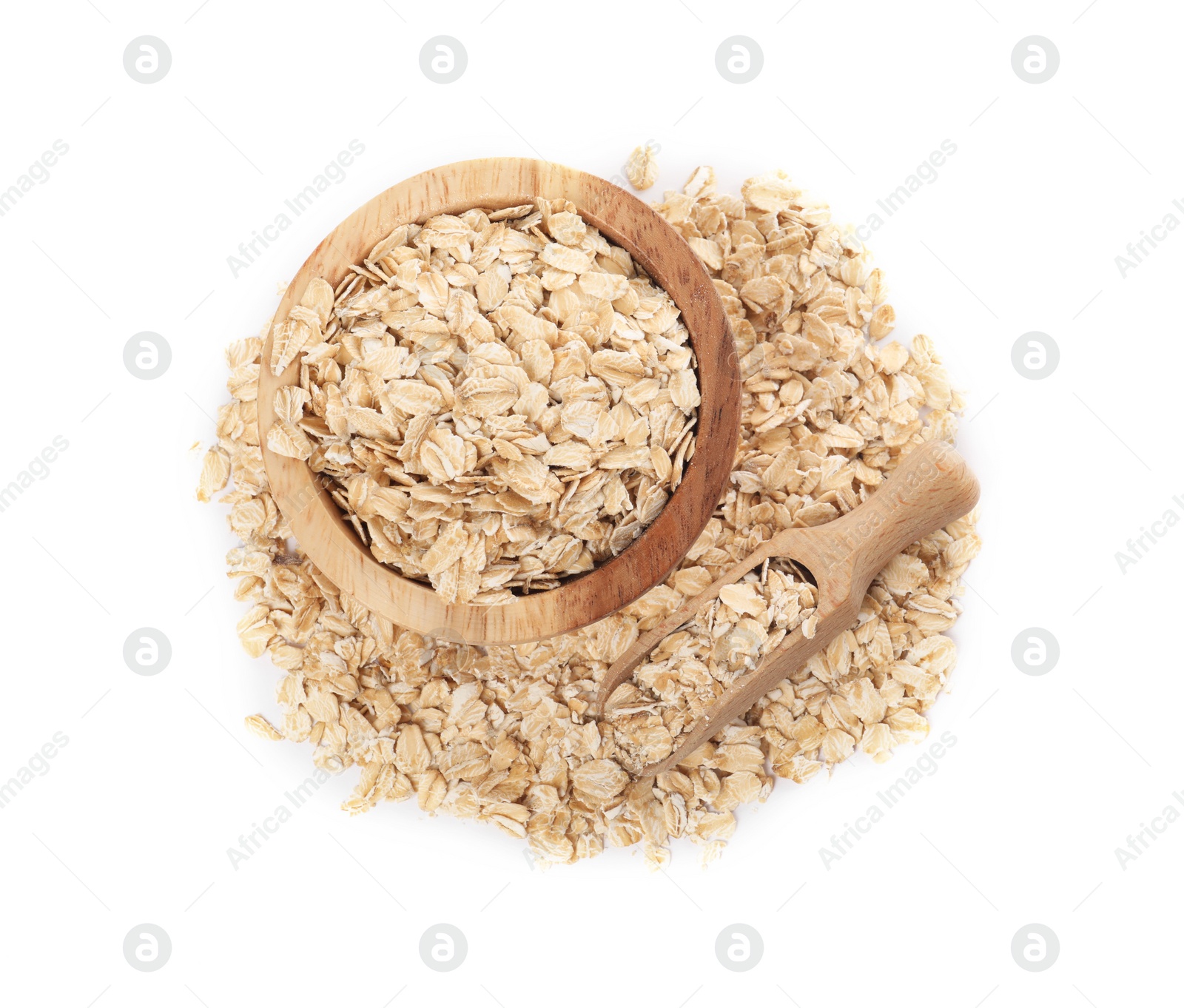 Photo of Wooden bowl and scoop with oatmeal isolated on white, top view