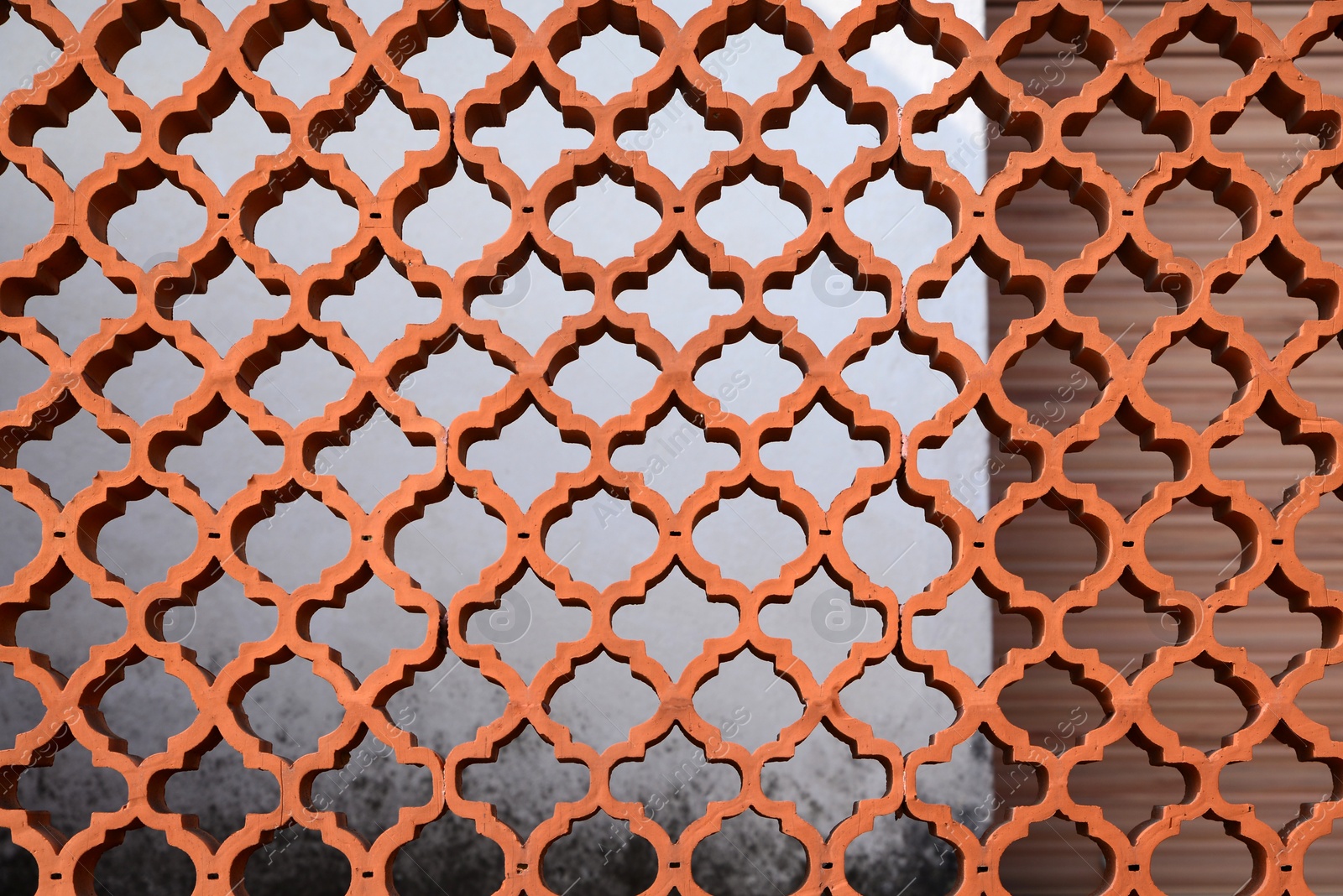 Photo of Closeup view of ornate brown fence outdoors