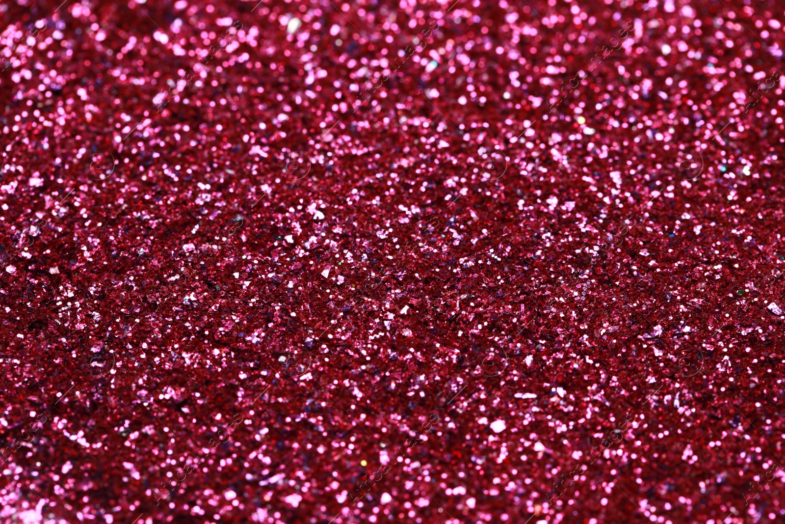 Photo of Beautiful pink shiny glitter as background, closeup