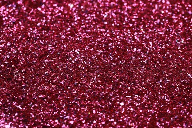 Beautiful pink shiny glitter as background, closeup