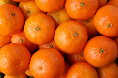 Photo of Delicious fresh tangerines as background, top view