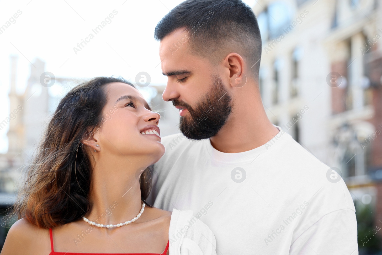 Photo of Happy young couple together on city street